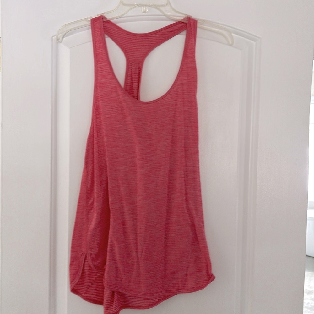 Lulu lemon racerrback tank 
Color is a cross between a pink and coral